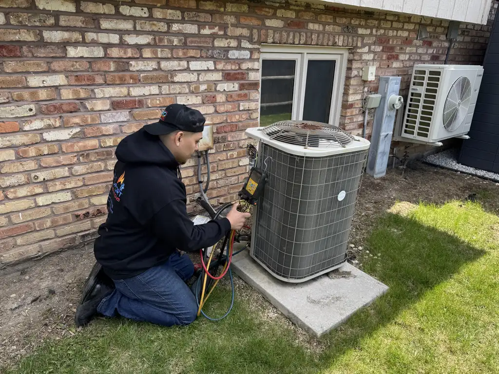 Pro Comfort Solutions technician diagnosing a residential air conditioner