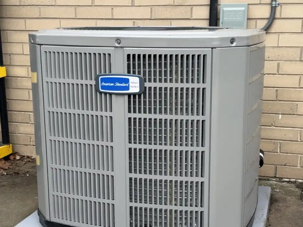American Standard air conditioning condenser installed by Pro Comfort Solutions outside a Chicagoland home