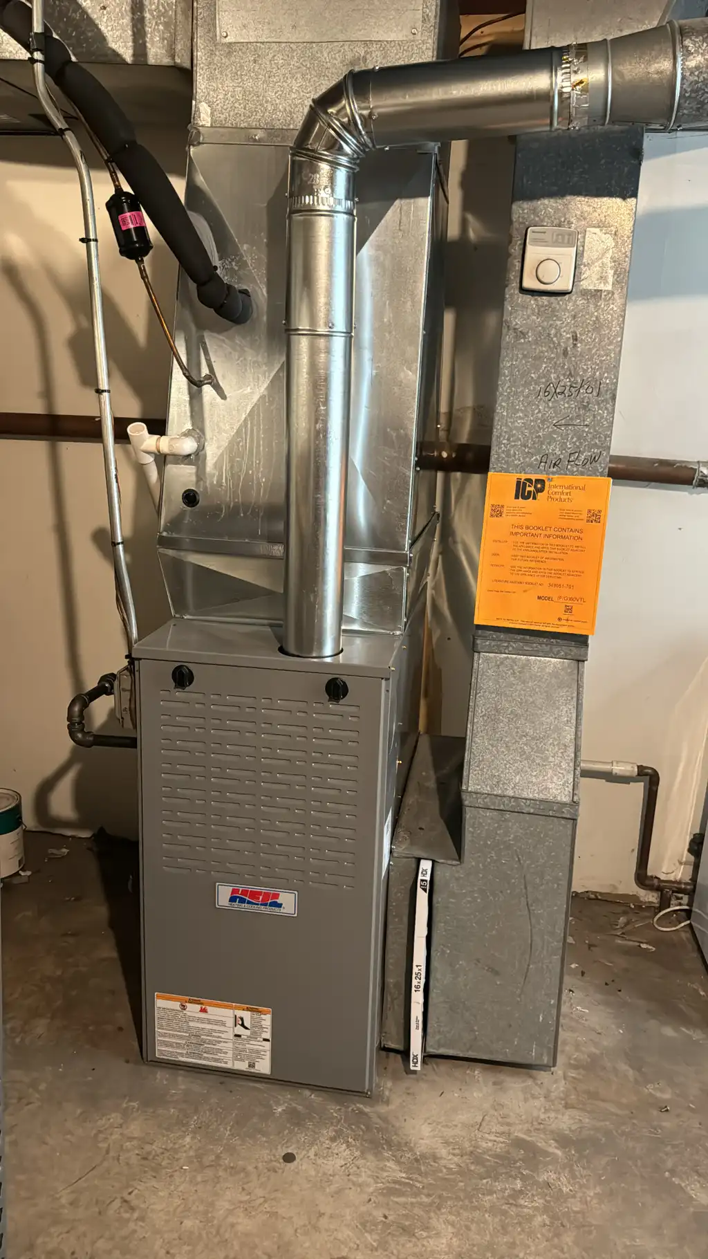 Pro Comfort Solutions technician completing a high-efficiency furnace installation in a Chicago basement