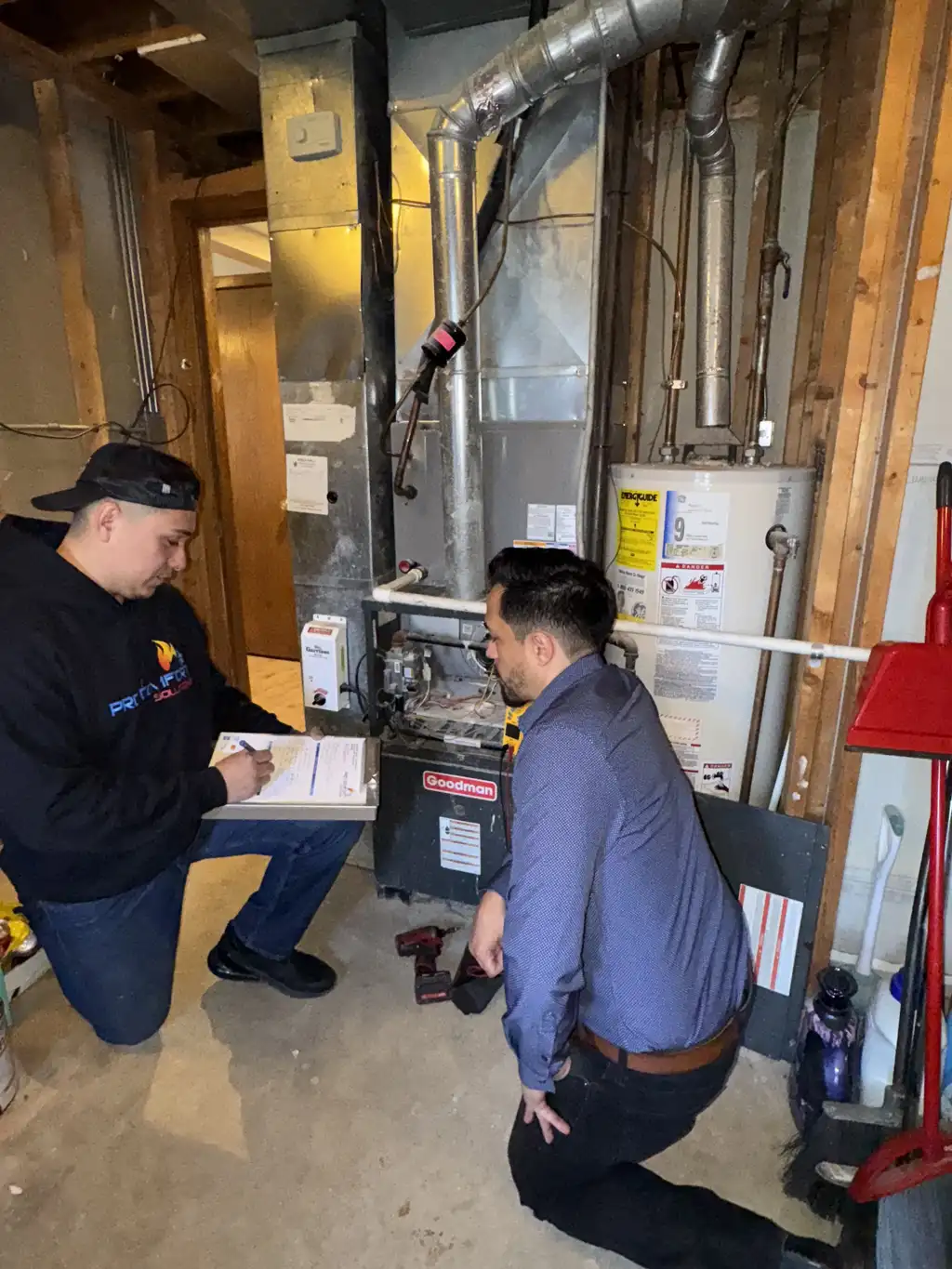 Pro Comfort Solutions technician walking a customer through completed work